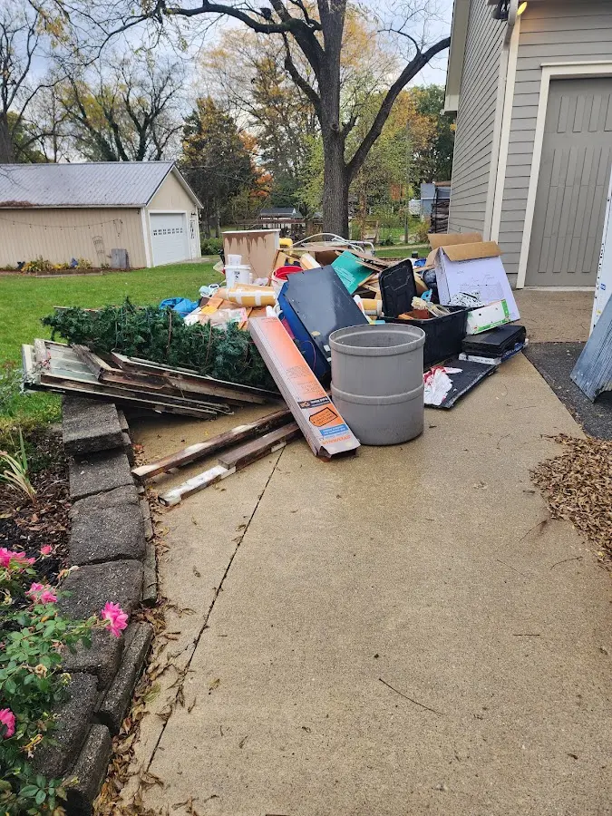 Dumpster being loaded with debris for Commercial Dumpster Rental in Brownsville